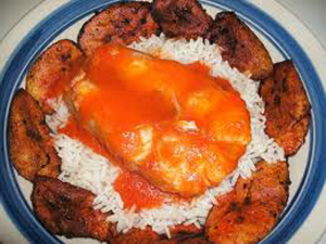 Catfish with rice, stew and plantain